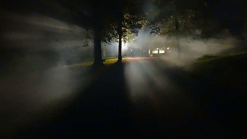Foggy night with lights in the sky